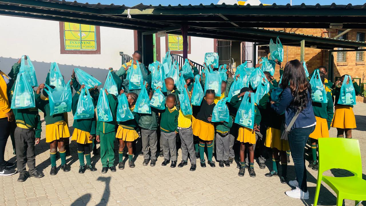 Learners celebrating with Fudumala jerseys at school