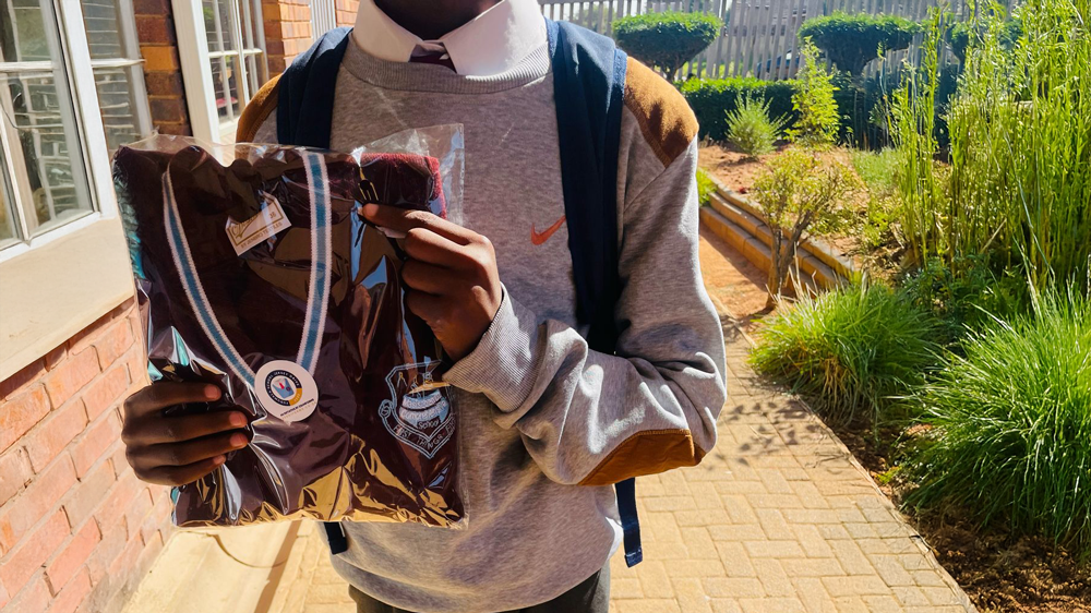 Volunteers preparing jerseys for corporate partnership
