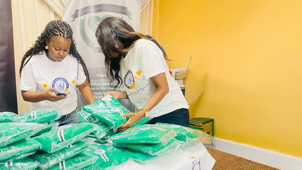 Volunteers sorting and packing jerseys for distribution