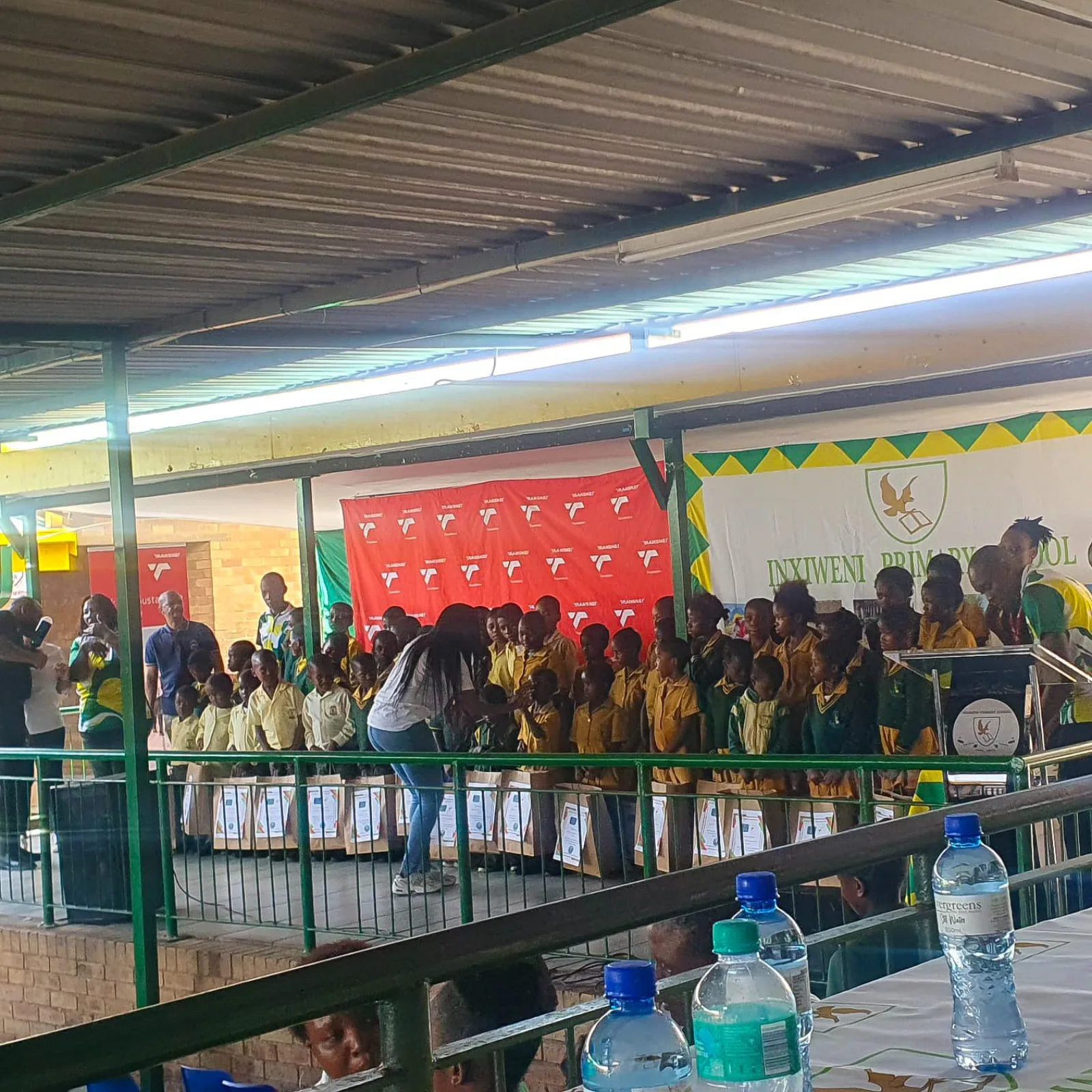 The handover ceremony in the school hall at Inxiweni Primary School with the Transnet Foundation backdrop