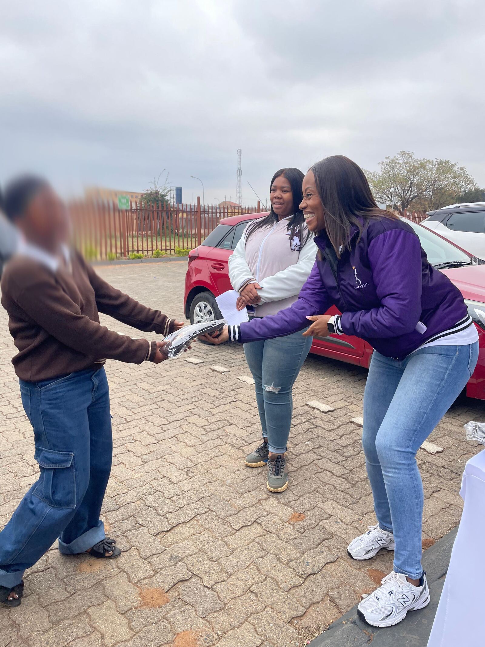 A Thuto ke Maatla Engineering School of Specialization learner receiving her new school jersey, 27 August 2026