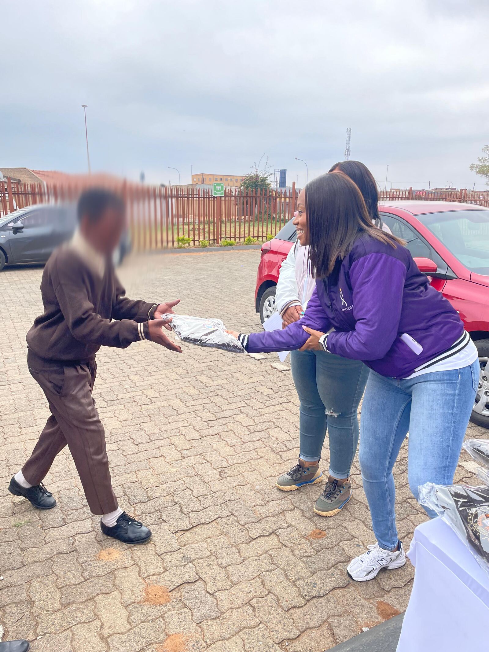 A Thuto ke Maatla Engineering School of Specialization learner receiving his new school jersey