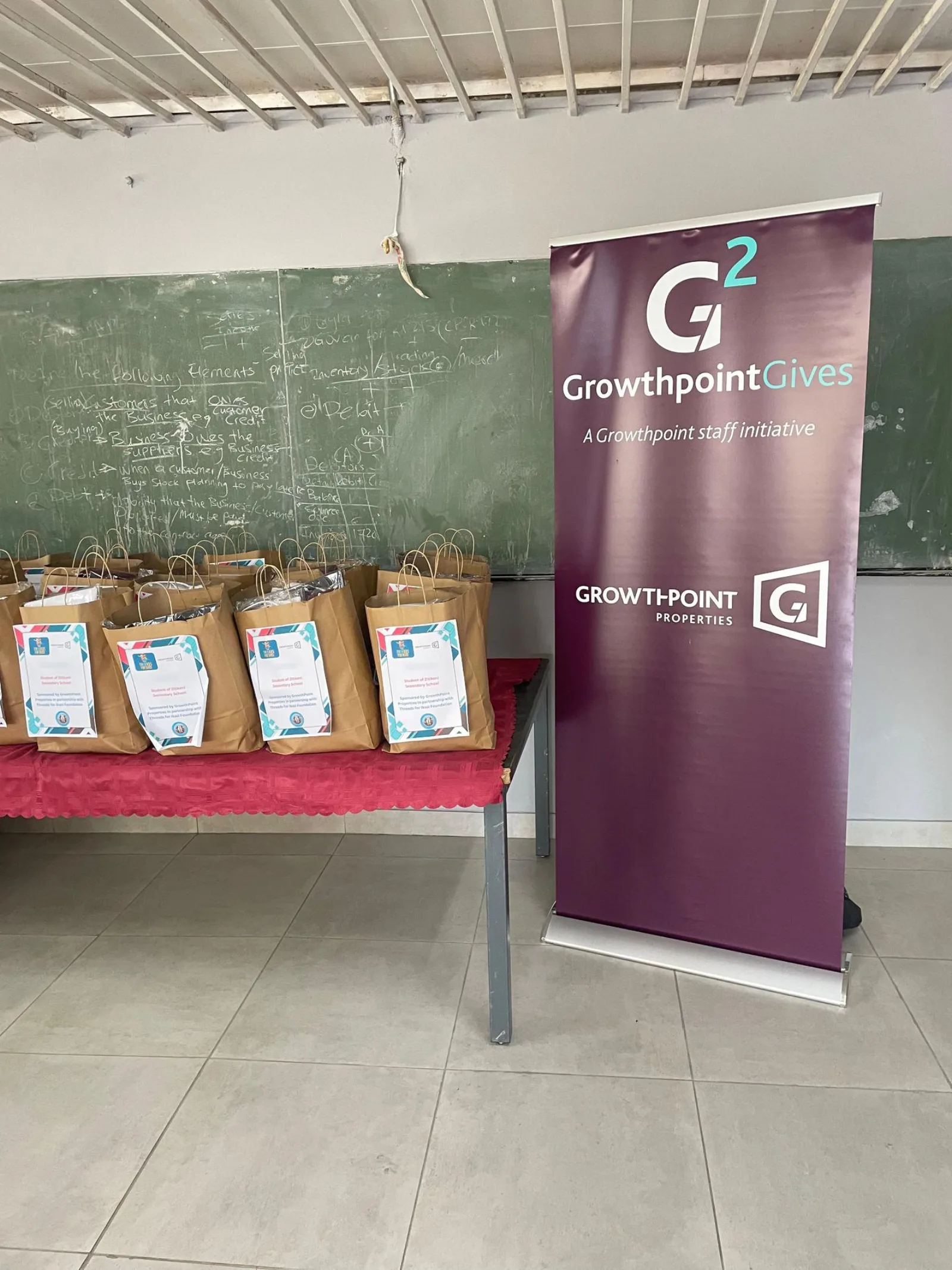 The 50 personalised handover bags prepared at Zitikeni Secondary School alongside the Growthpoint Gives banner